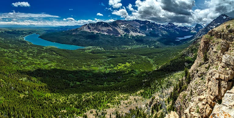 Explore the breathtaking mountains and lush valleys of Glacier National Park, captured in vivid detail.