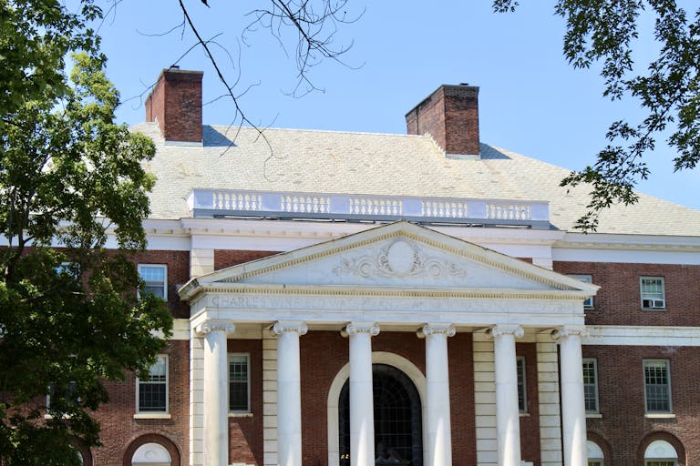 A classic brick university campus building with columns in Burlington, Vermont.