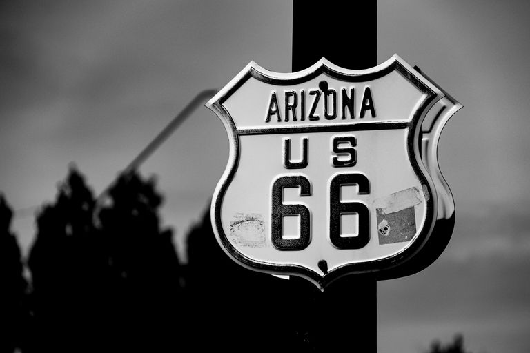Black and white photo of the iconic Route 66 sign in Arizona, USA.