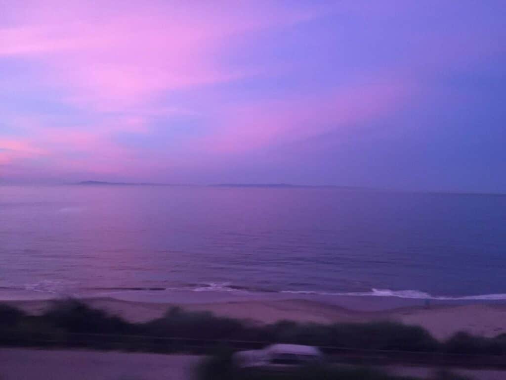 A purple and blue sunset as seen from the Amtrak Coast Starlight