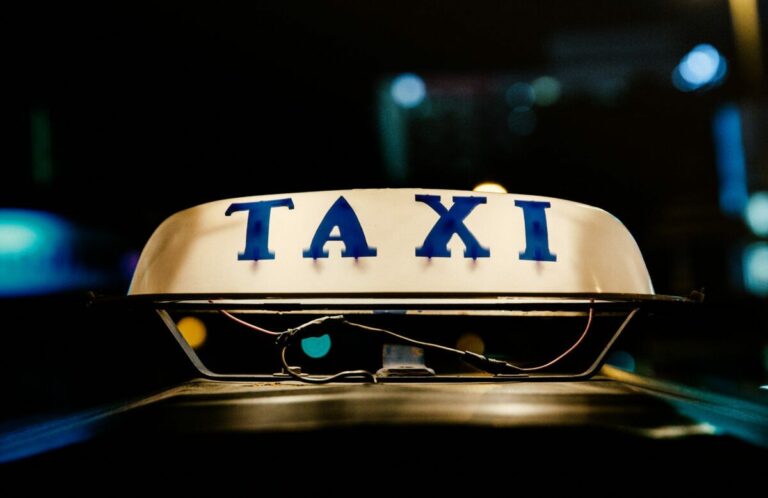 A lit Taxi sign