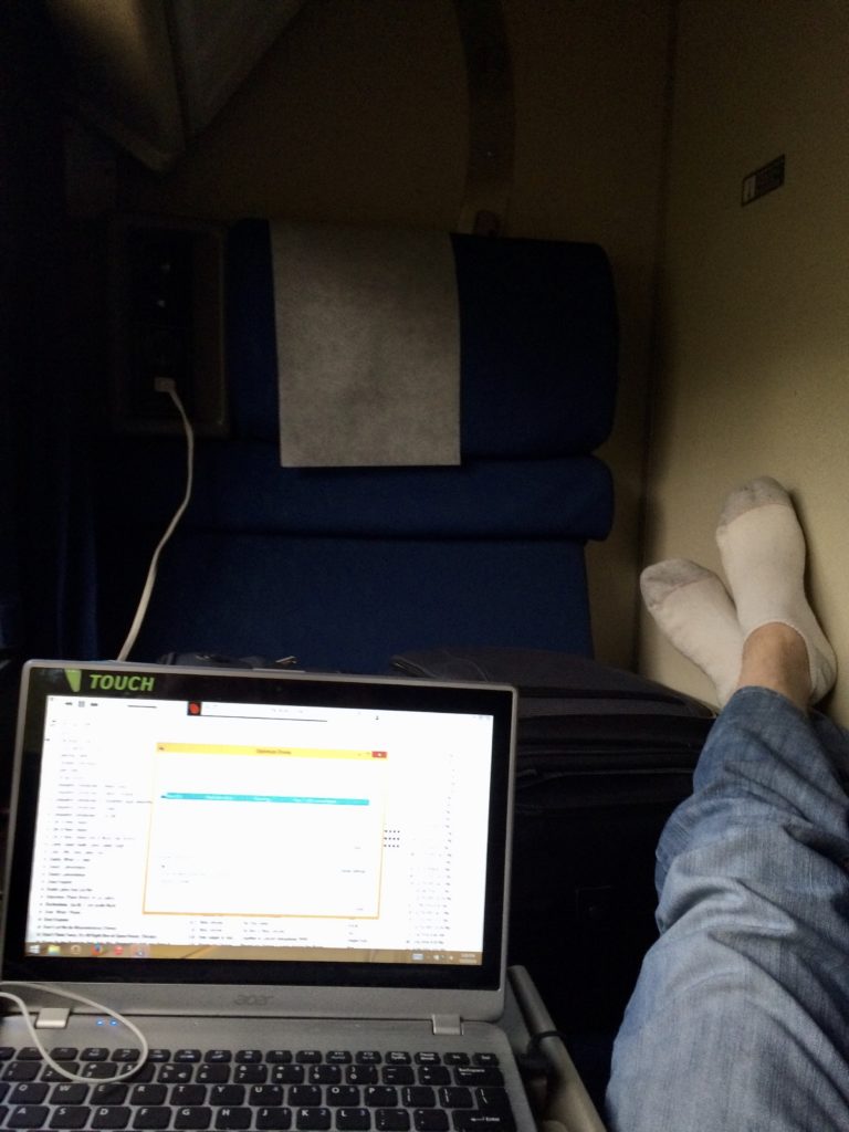 Kev working on the Travels with Kev in an Amtrak Superliner roomette. 