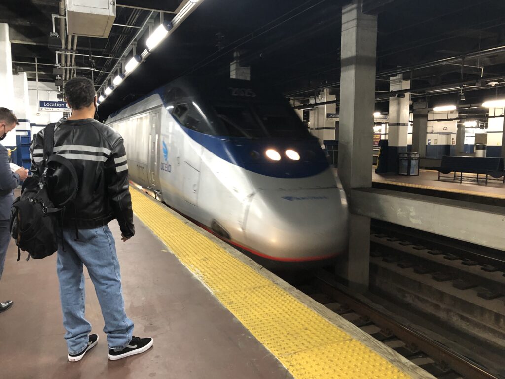 Acela in 30th street station, people waiting to ride Amtrak 