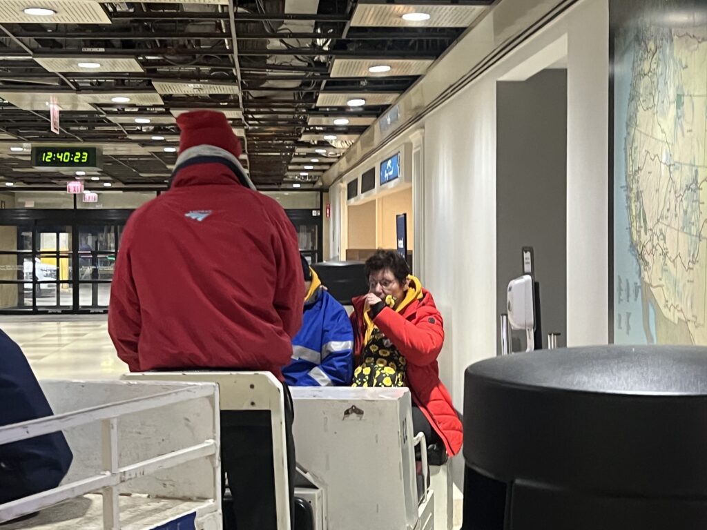 Amtrak Red Caps helping passengers