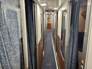 I was looking towards the car's center down the middle of a Superliner roomette hallway.