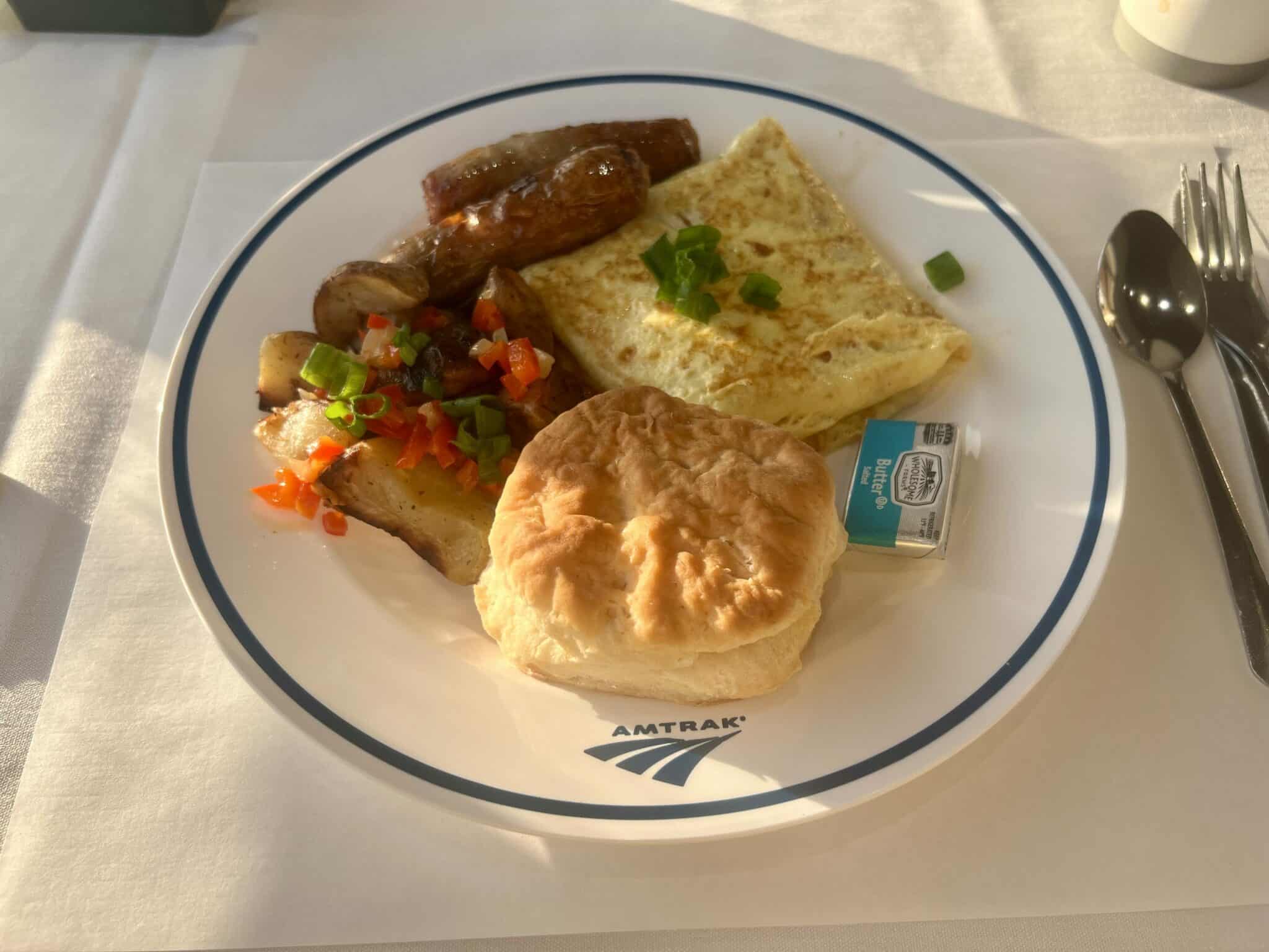 An Amtrak omelet breakfast with biscuit and potatoes.