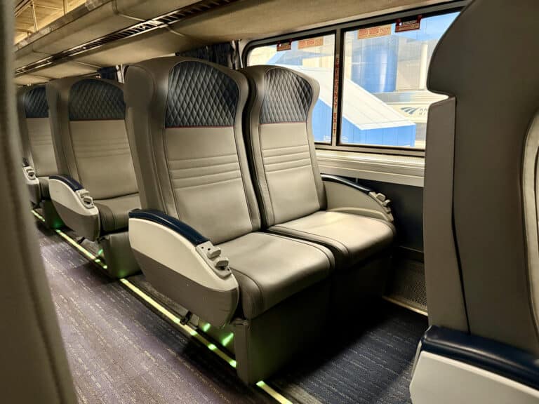 Amtrak Superliner Coach seats, faux leather in an 2 by 2 layout.